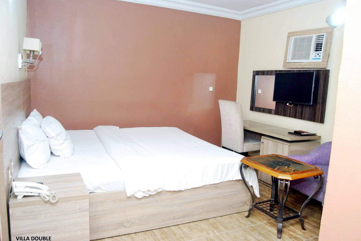 Indulge in the spaciousness and elegance of the Villa Double room at Villa Toscana Hotel Enugu. Designed for up to two adults, this room offers a comfortable and tranquil haven for a restful stay.